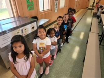 A kindergarten class standing in a line